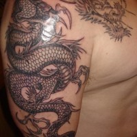 Impressive asian dragon tattoo in black