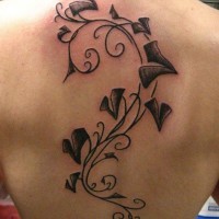 Black ivy tattoo on back