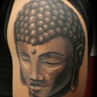 Stone buddha head black ink tattoo