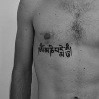 Hindu buddhist mantra black ink tattoo