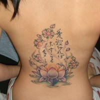 Lotus with buddhist writings tattoo on back