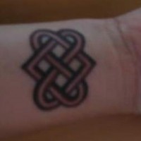 Buddhist love knot wrist tattoo