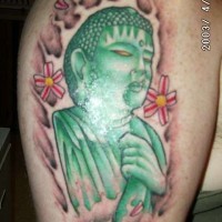 Le tatouage de Bouddha en pierre vert
