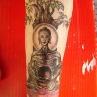 Starving buddha under tree tattoo
