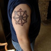 Le tatouage de la roue de la vie bouddhiste