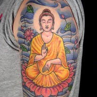 Meditating buddha on lotus coloured tattoo