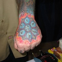 Buddhist blue lotus arm tattoo
