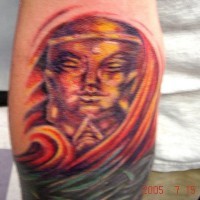 Colourful golden buddha tattoo