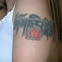 Buddhist mantra with lotus armband tattoo