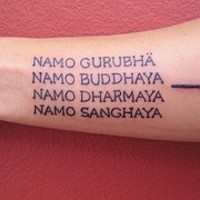 Buddhist mantra text tattoo