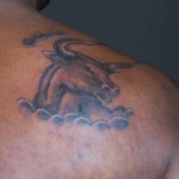 Realistic bull head in cloud tattoo on shoulder