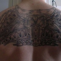 Bull themed pattern tattoo on back