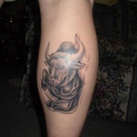 Bull head tattoo on leg