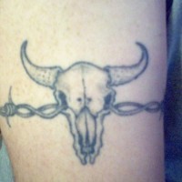Barb wired bull skull tattoo