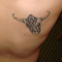Bull head with tracery tattoo