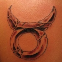 Stone taurus symbol tattoo