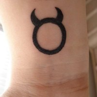 Bull symbol wrist tattoo