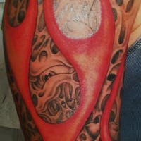Flesh in red flame tattoo