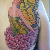 Colourful butterfly lady on flowers tattoo