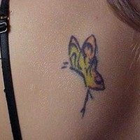 Yellow butterfly tattoo on back