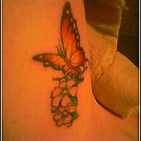 Monarch butterfly on flowers tattoo