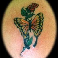 Monarch butterfly on red rose tattoo
