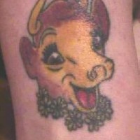 Joyful cartoon cow tattoo