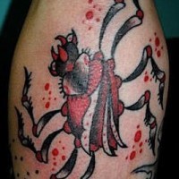 Surreal black and red spider tattoo