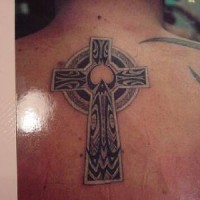Stone celtic cross tattoo on back