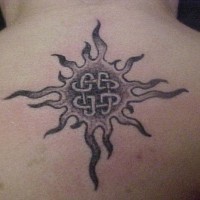 Celtic sun tattoo on back