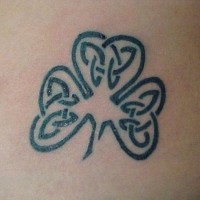 Shamrock with celtic tracery tattoo