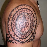Celtic triangle pattern shoulder tattoo
