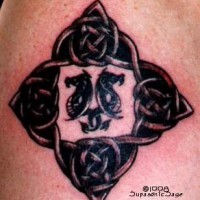 Horse fishes in celtic knot tattoo