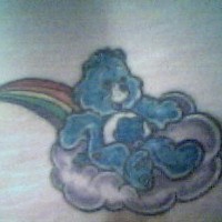 Blue bear riding on cloud in rainbow tattoo