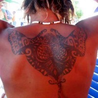 Celtic knot tracery tattoo on back