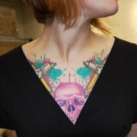 Pink skull chest tattoo