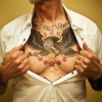 Eagle with red stars chest tattoo