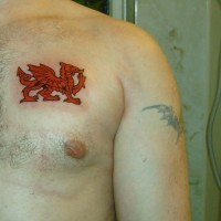 Red welsh dragon tattoo on chest
