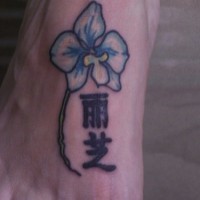 Chinese flower tattoo on foot