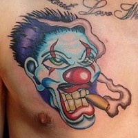 Smoking clown face tattoo on chest