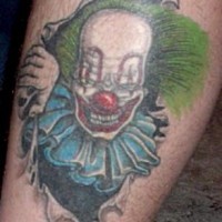 Le tatouage de clown méchant de la déchirure de la peu
