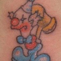 Cartoonish clown with hammer tattoo