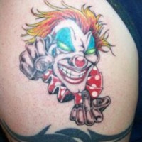Vulgar clown colourful tattoo