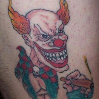 pagliaccio con capelli di fuoco con sigaretta tatuaggio - Tattooimages.biz