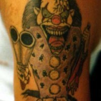 Insane clown with shotgun tattoo