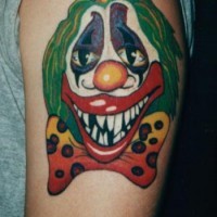 Colourful bad clown tattoo