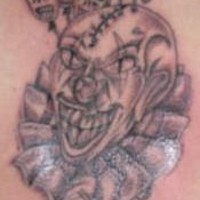 Black clown with lobotomy tattoo