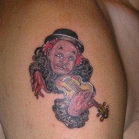 Sad clown playing on violin tattoo