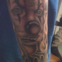 Juggalo style clown face in black tattoo