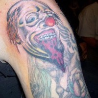 Dead zombie clown tattoo on shoulder